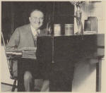 Earl May at his announcer's desk in the studio in the mid-1920s
